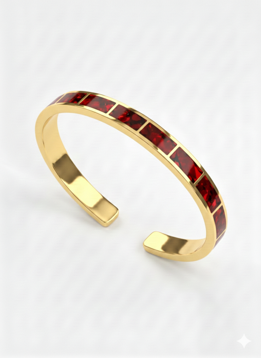 Gold bracelet with red stones